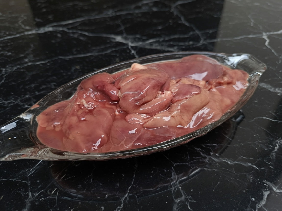 Thawed Chicken Liver in a glass dish - Canine Naturals Pakistan
