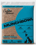 A 1kg bag of Canine Naturals Munchbowl Chicken & Fish Formula dry dog food, featuring a bright blue and white packaging design with black text and silhouettes of a dog and cat.